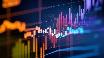background image: business graphs on a computer screen