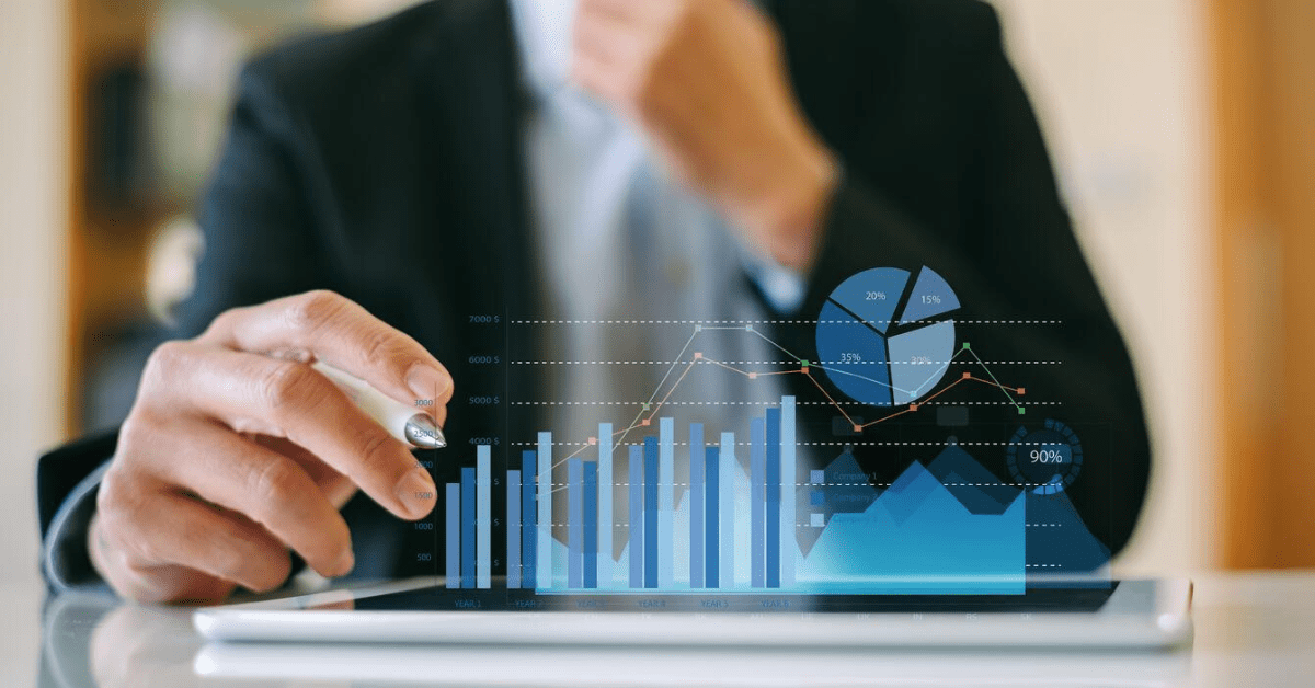 man in front of graphic of arrow trending upward (1)